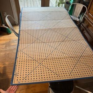 Large cardboard sewing measuring board